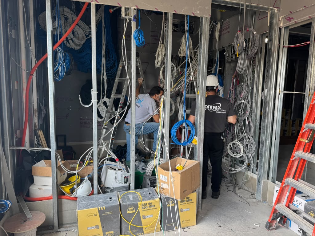 Connex technicians running structured cabling during a fit-out